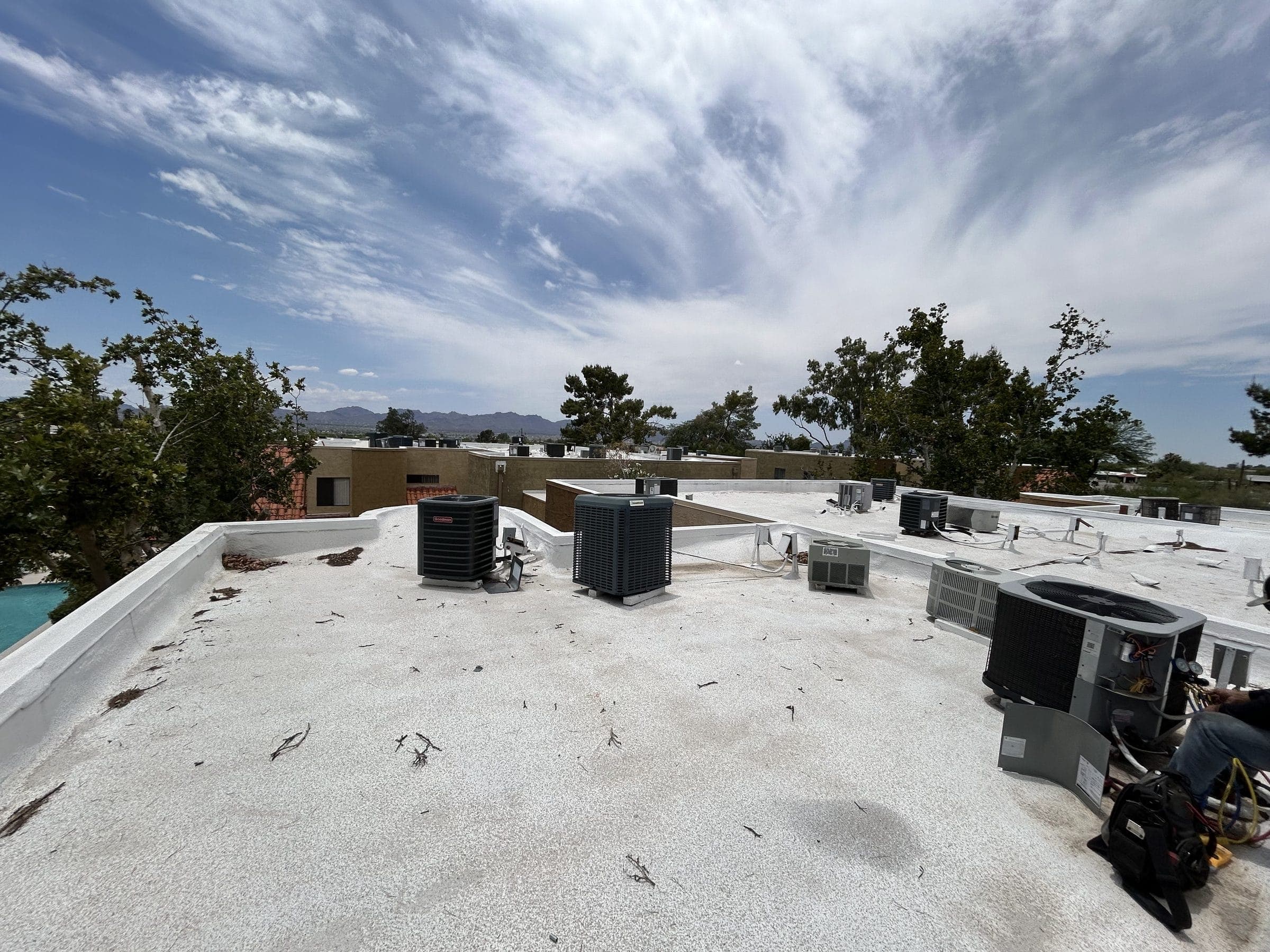 Rows of condensers on an apartment community rooftop