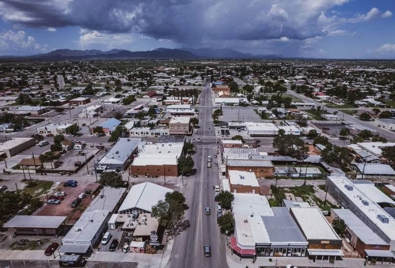 Aerial view of downtown Willcox with storm clouds over the mountains